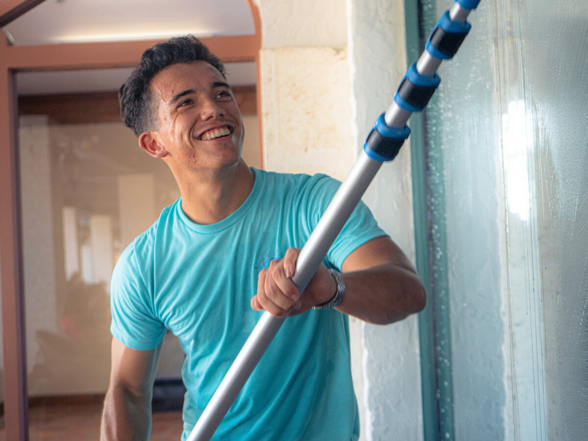 Smiling Coastal King technician on site at a client's home