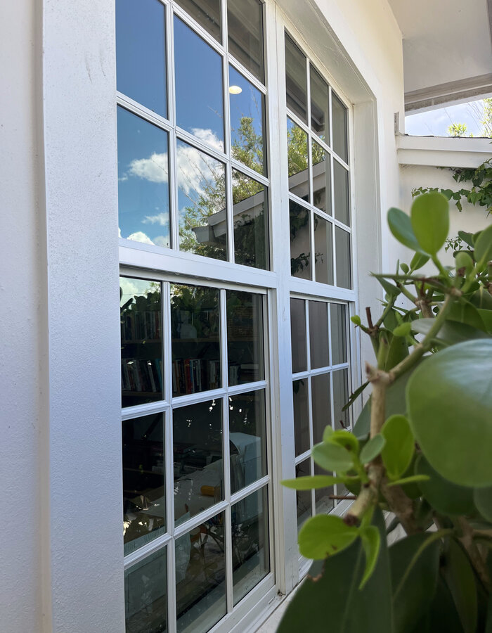The same window crystal clear after Coastal King cleaning